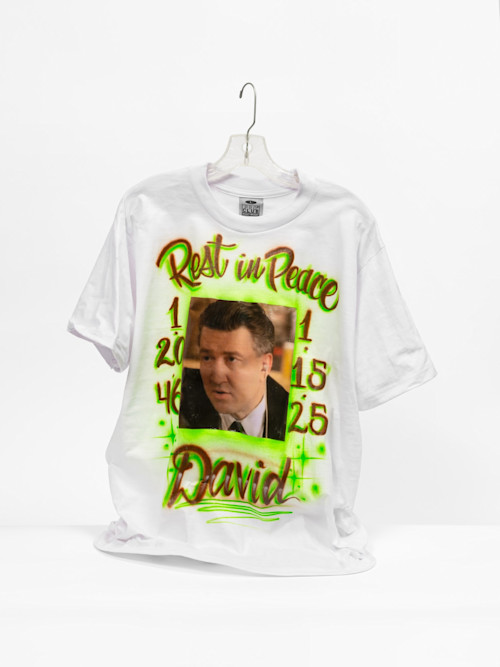 Mario Ayala, David Lynch Memorial Tee, 2025. Acrylic and inkjet transfer on Pro, Club T-shirt and plastic hanger, 33 x 23 x 11 in (84 x 58 x 28 cm)
