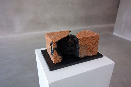 Jesse Greenberg, Cell Growth Orange with Black, 2014. Resin, pigment, bbs, 6 x 6 x 9 in, 15 x 15 x 23 cm