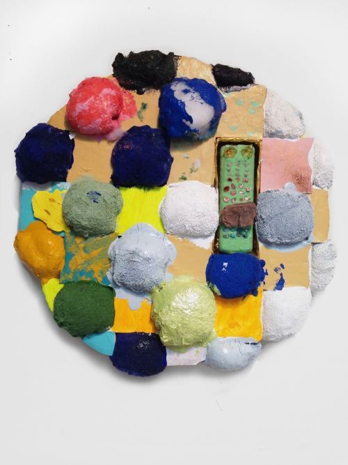 Brian Belott, TBT, 2017. Cotton batting, colorfast paper, acrylic paint, matte medium, remote control with matte medium, colored sand and stones, 21 x 21 x 5 in, 53 x 53 x 13 cm