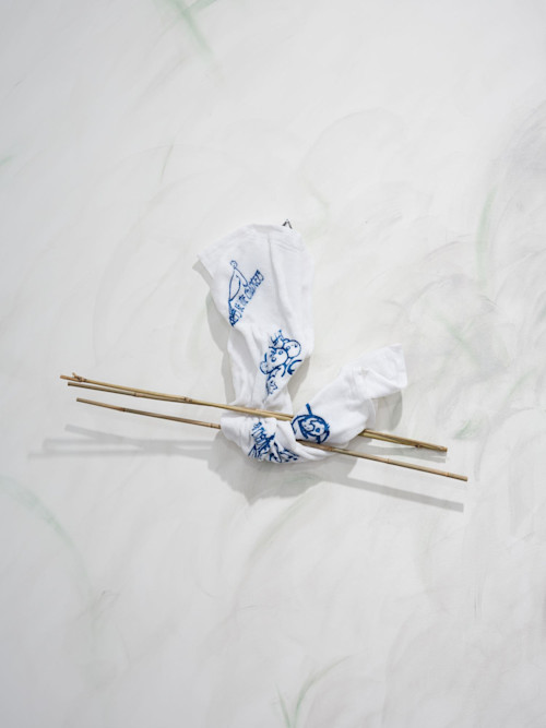 Egle Kulbokaite and Dorota Gaweda, For a Future X (I), 2016. Embroidery, towel, paraffin wax, bamboo sticks, 21 x 35 in, 53 x 90 cm