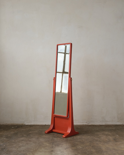 Noah Cohen, Standing Mirror, 2025. Chinese elm, mirror, brass, egg temera paint, 64 x 19 x 16 in (163 x 48 x 41 cm)
