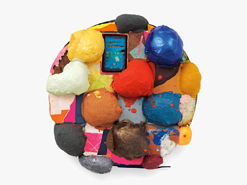 Brian Belott, Tondo Puff, 2019. Cotton batting, colorfast paper, acrylic paint, matte medium, calculator with matte medium, colored sand and stones, 21 x 21 x 5 in (53 x 53 x 13 cm)