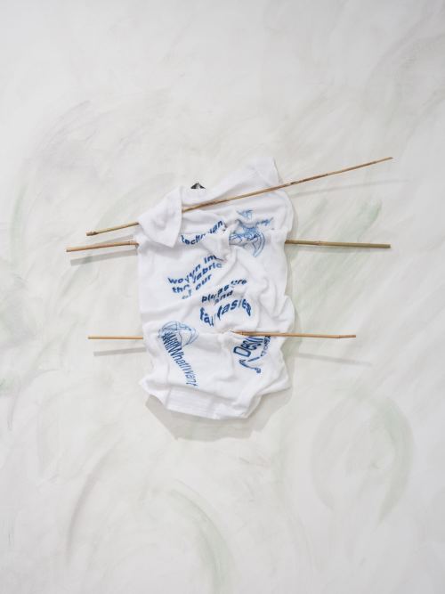 Egle Kulbokaite and Dorota Gaweda, For a Future X (II), 2016. Embroidery, towel, paraffin wax, bamboo sticks, 28 x 35 in, 71 x 90 cm
